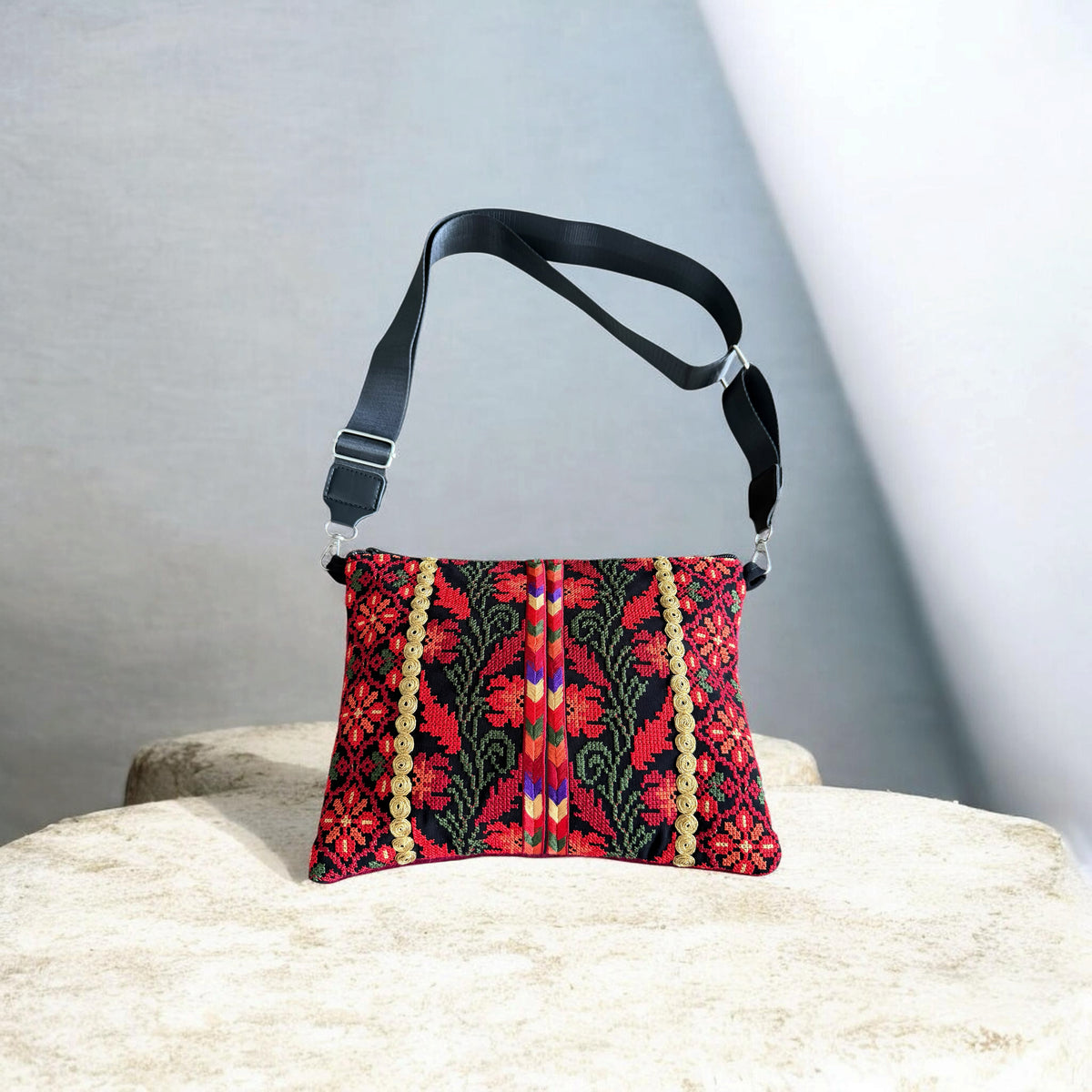 Sinsal Crossbody with red floral tatreez, gold-tone circular trim, and a black adjustable strap.